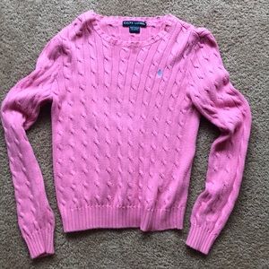 A pink polo Ralph Lauren sweater